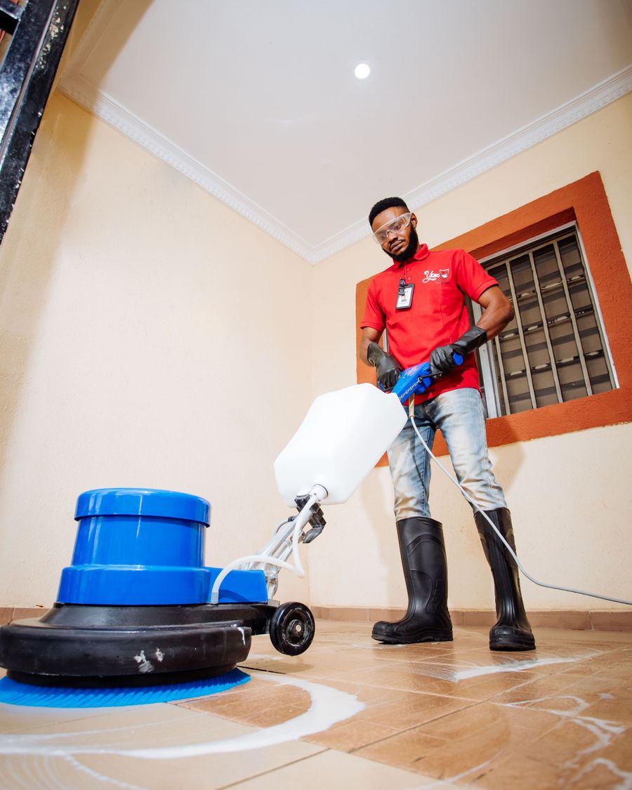 Yaz team member polishing a floor